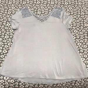 Short sleeved dressy top with lace detailing.